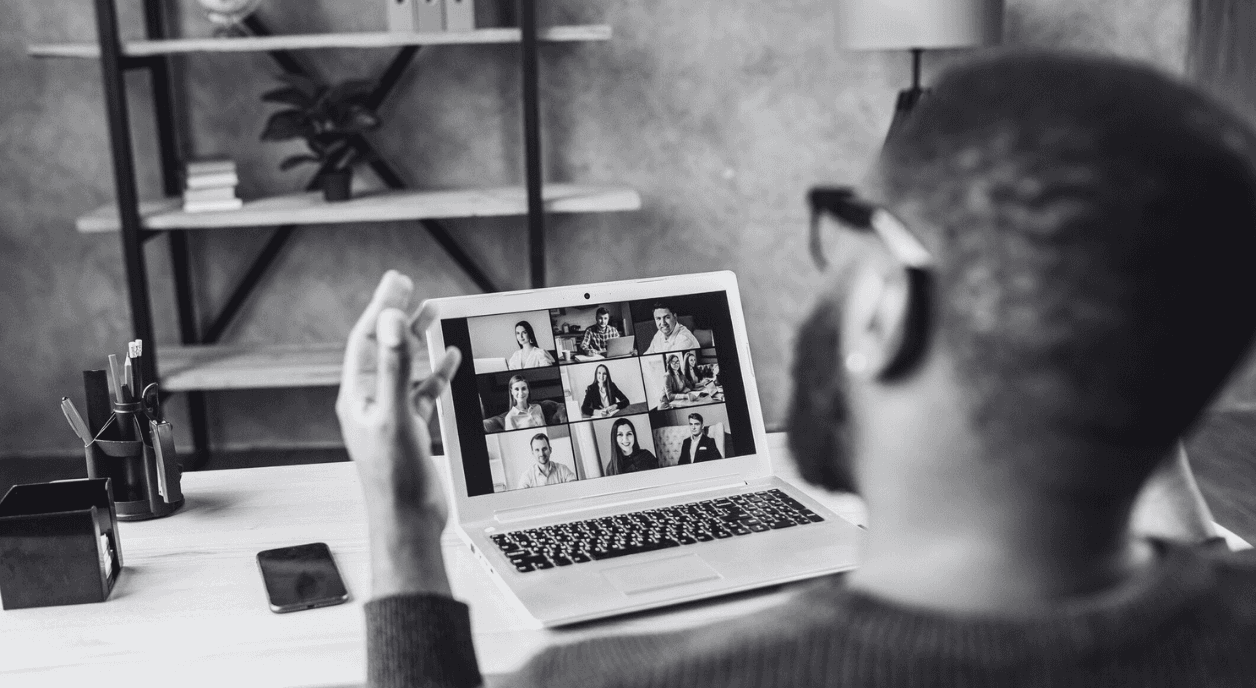 A person on a video call with nine different remote team members.