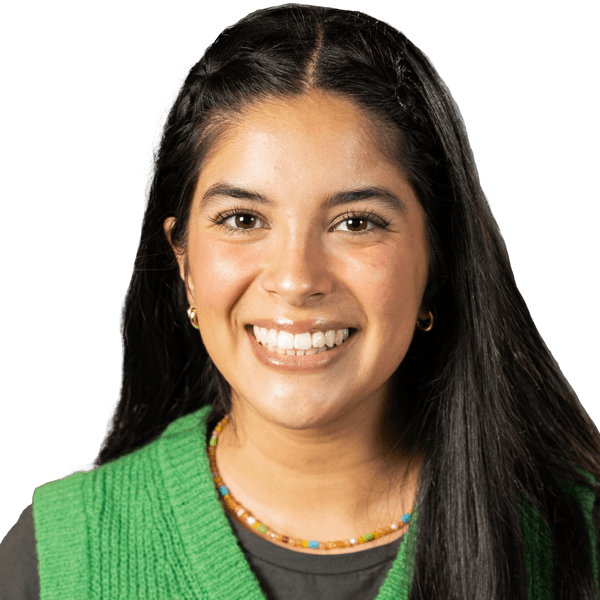 Headshot of Ariella Pacheco, Communications and Brand Awareness intern at Candid, in a green vest.