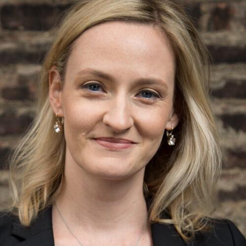Headshot of Asha Curran, CEO of GivingTuesday.