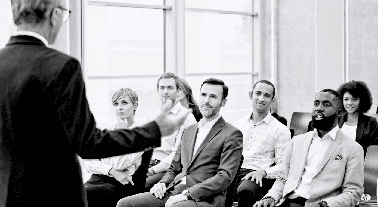 A person presenting on fundraising mistakes.