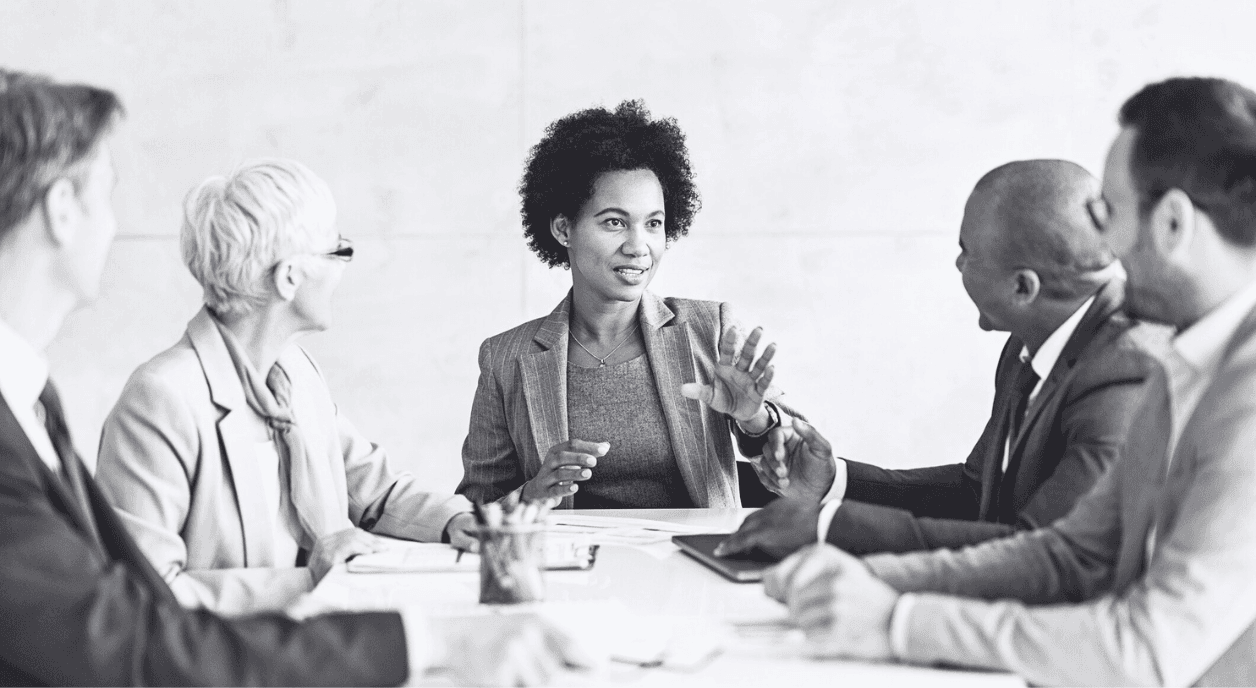 A Black woman leading a meeting.